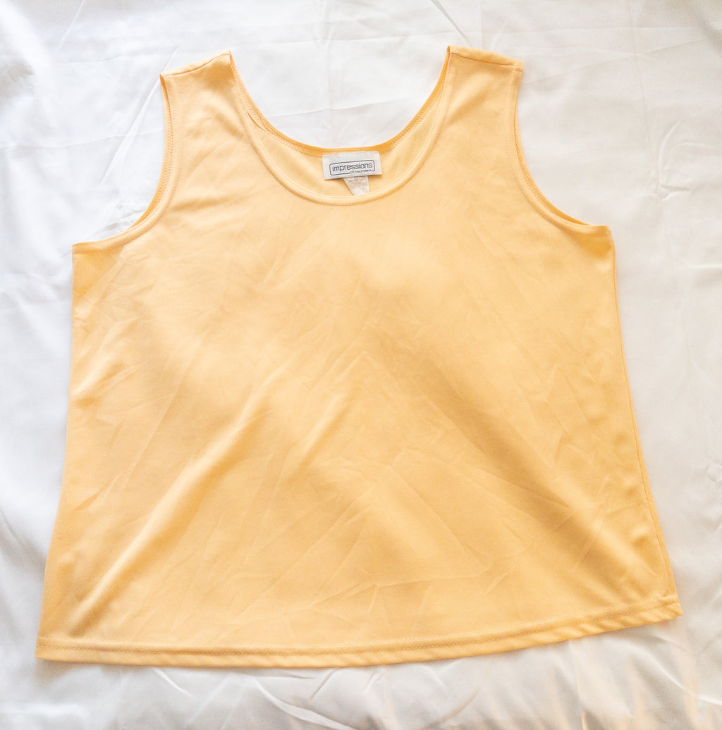 Polera sin mangas amarilla marca Impressions talla L